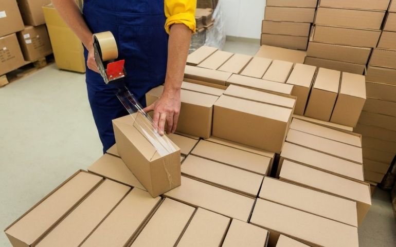Packaging materials and protective inserts arranged in a production facility